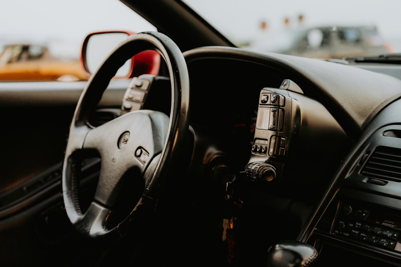 Close view of a steering wheel and driver controls