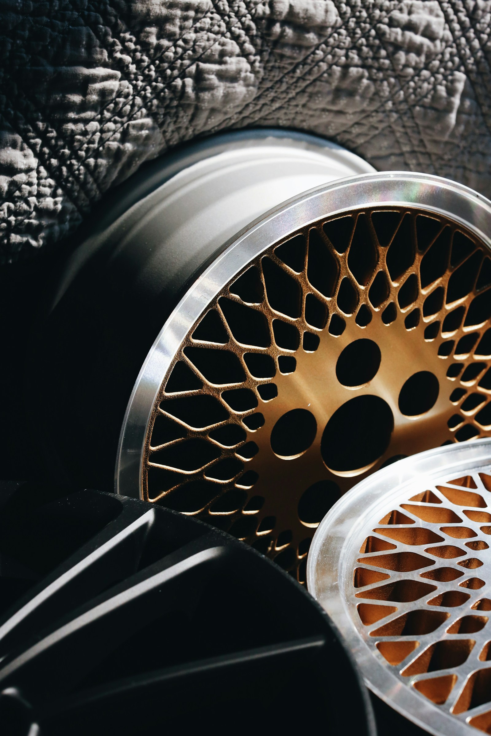 Close-up of a tire tread and alloy wheel